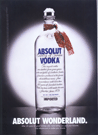 paper ad of bottle with scarf and snow.