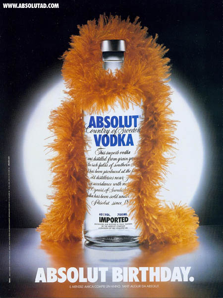 Happy Birthday Absolut! Bottle with an orange boa around it's neck.