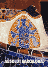 Mosaic tiles on a fountain in the shape of a bottle.