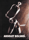Picture of a pair of dancing shoes with ribbon shaped as a bottle.