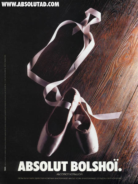 Picture of a pair of dancing shoes with ribbon shaped as a bottle.