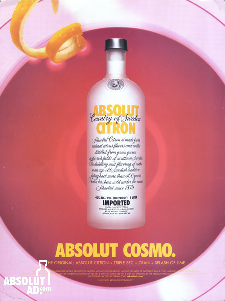 Looking down into a pink martini glass with a bottle of Citron in the center.