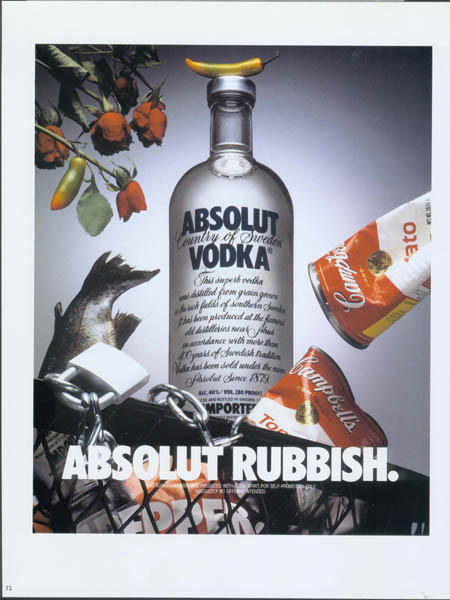 Trash can with Absolut bottle and pepper ad in it.