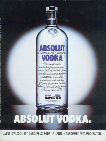 Standard Absolut bottle under spotlight.