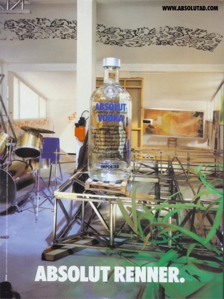 Large glass bottle on top of some structure in a studio.