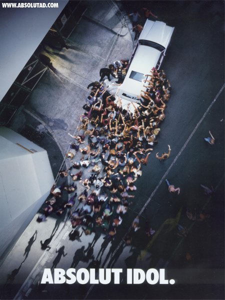 Groupies surrounding a limo.