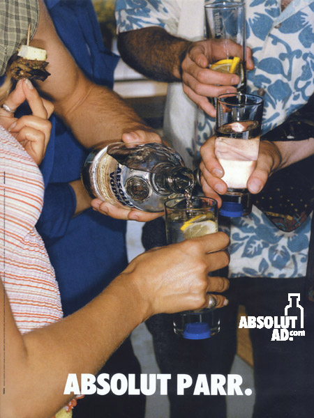 Group of people pouring Absolut at a party.